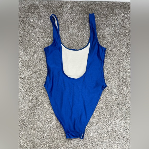 Blue one piece swimsuit with saying, “you do you boo boo,” in white letters. - Picture 2 of 5